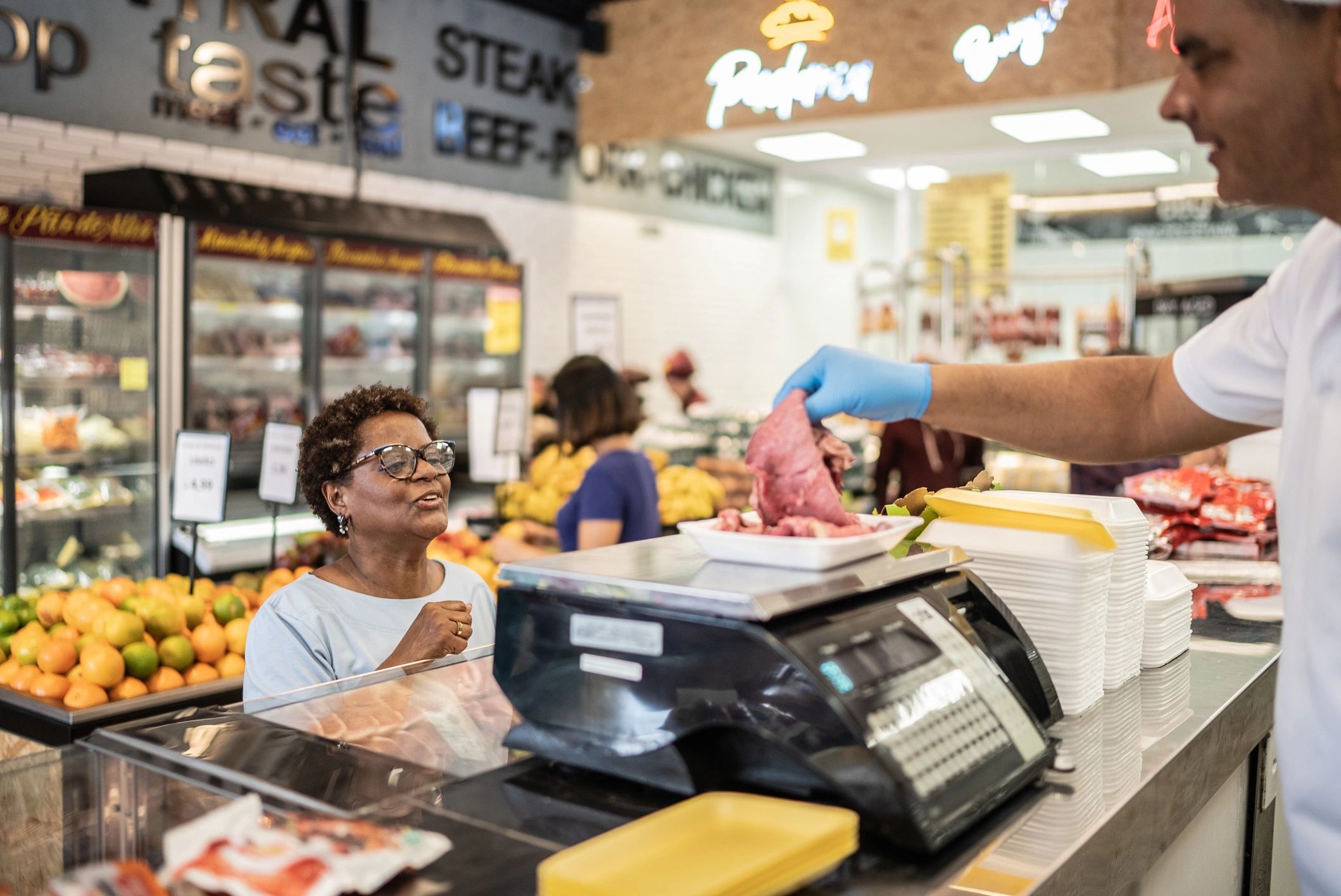 Customer at a butcher counter
