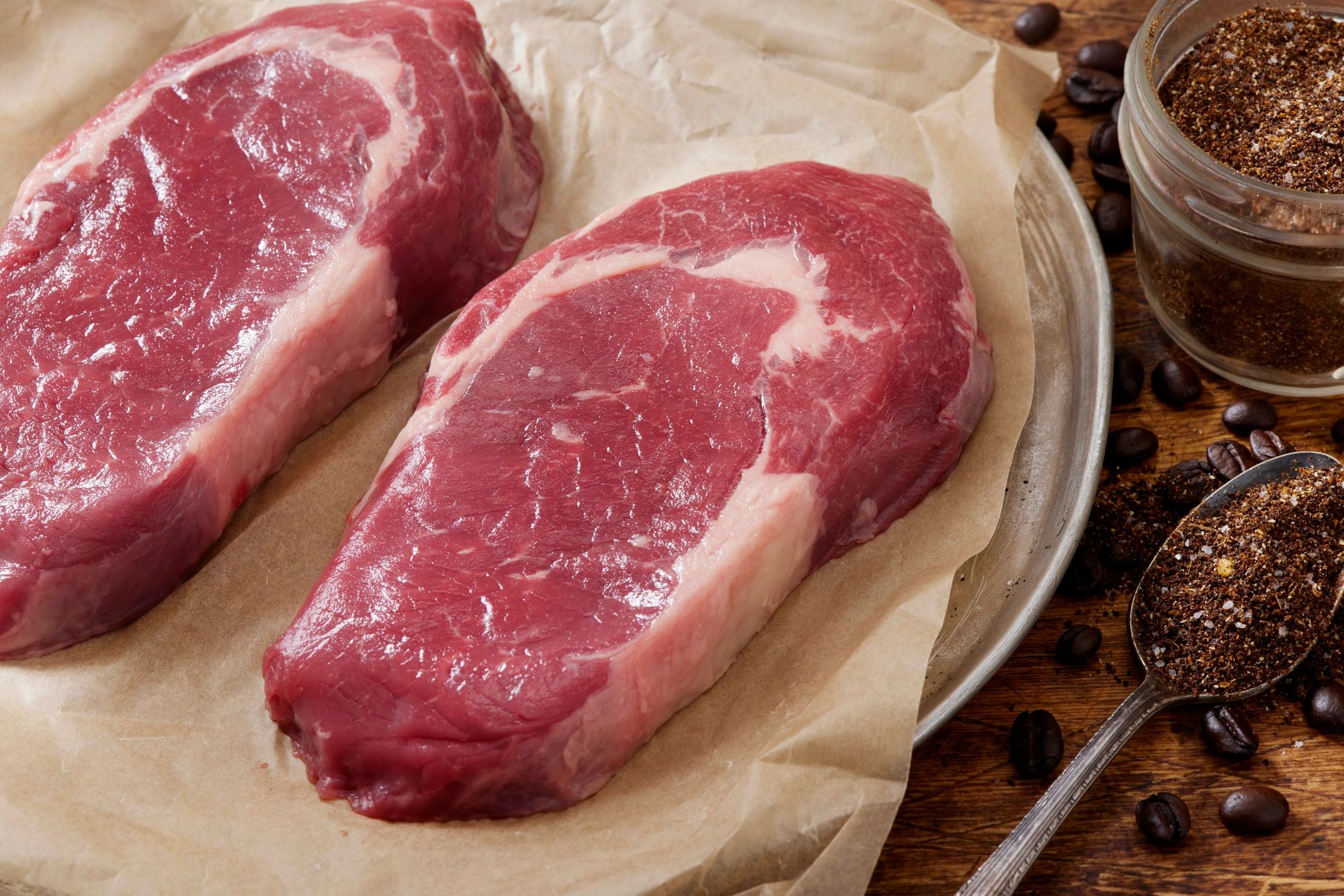 Close-up of seasoned ribeye steaks ready to cook