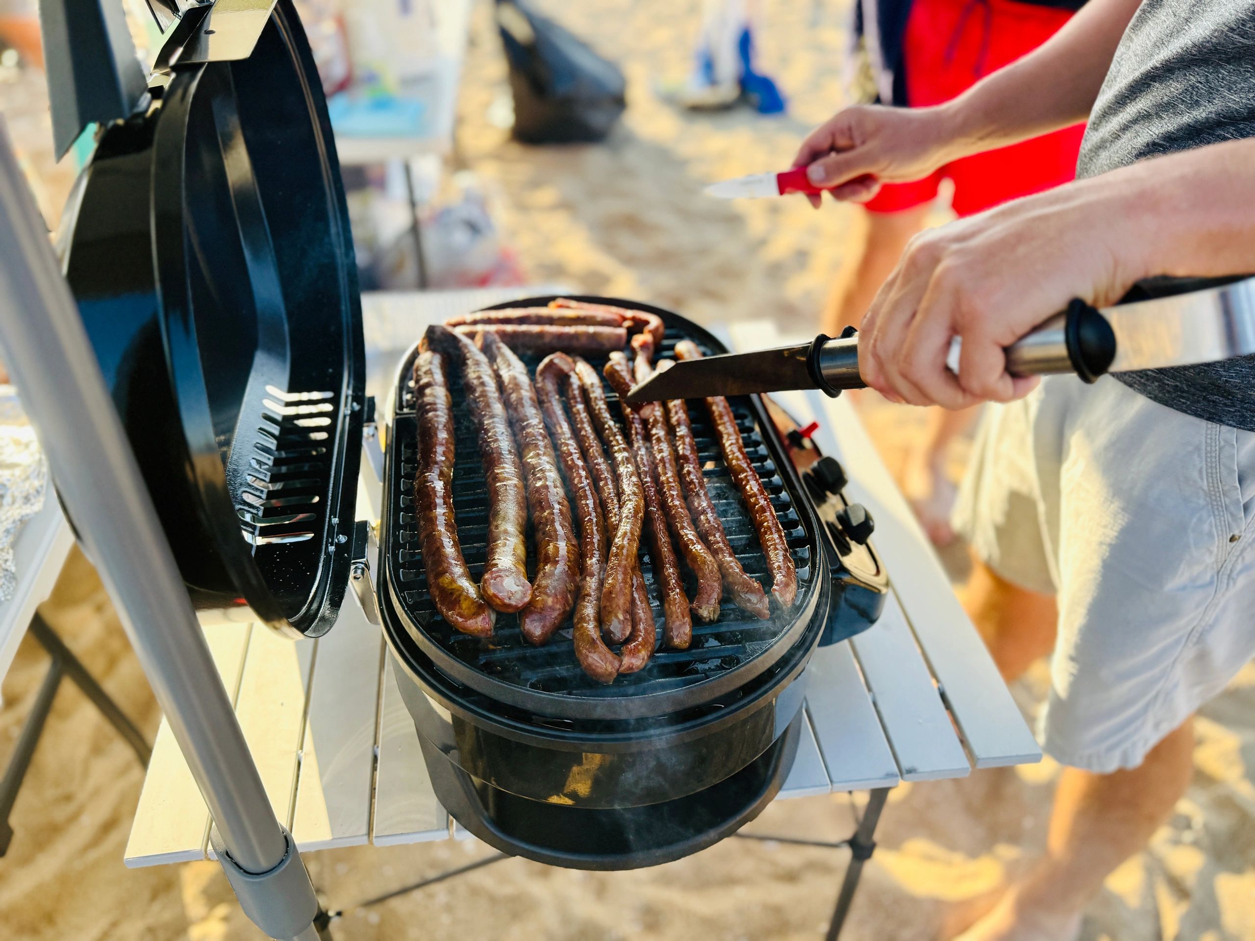 Sausages cooking on a grill
